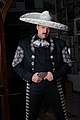 Mariachi singer wearing silver embroidered charro outfit