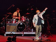 Olsen (right) performing in 2023