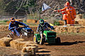 Image 7 Lawn mower racing Photo credit: Fir0002 Two racers cross the finish line of the 250cc class at the 2007 Swifts Creek lawn mower races. In this motorsport, competitors race modified lawn mowers, usually of the ride-on or self-propelled variety. Original mower engines are retained but blades are removed for safety. Lawn mowers have also been used in kart racing, a different sport. More selected pictures