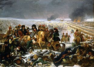 Painting shows Napoleon and his staff mounted on horses. In the foreground is a pile of dead and wounded soldiers.