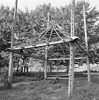 The structure of a barrack; the holes in the post are elevations where pins can be placed as the roof is raised and lowered