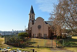 Nederduitsch Hervormde Church, Vrededorp, with the Hillbrow Tower and city center of Johannesburg in the back
