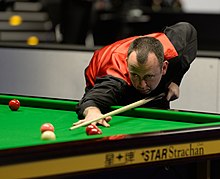 photo of Mark Williams playing a shot