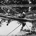 Two men in a canoe (paopao, va'a) fishing in Samoa, c. 1914