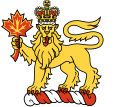 The crest of the King of Canada (and badge of the office of the Governor General of Canada), a crowned lion holding a maple leaf atop a torse.