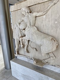 Recently removed metope from the Parthenon, depicts a Centaur and Lapith in battle.