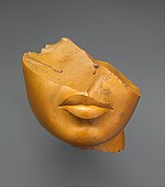 Fragment of a queen's face; 1353–1336 BC; yellow jasper; height: 13 cm, width: 12.5 cm, depth: 12.5 cm; Metropolitan Museum of Art