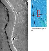 Hrad Vallis may have been formed when the large Elysium Mons volcanic complex melted ground ice, as seen by THEMIS.