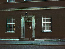 A dim shot of the door of 10 Downing Street
