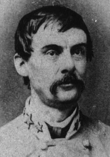 Confederate officer with stars on his collar, dark hair and mustache