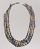 Sumerian necklace beads; 2600–2500 BC; gold and lapis lazuli; length: 54 centimetres (21 in); Metropolitan Museum of Art