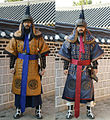 Modern reenactors wearing a complete Dujeong-gap set. While conventionally shown as red, the fabric could be of various colors.