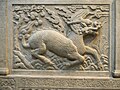 Image 20Gilin with the head and scaly body of a dragon, tail of a lion and cloven hoofs like a deer. Its body enveloped in sacred flames. Detail from Entrance of General Zu Dashou Tomb (Ming Tomb). (from Chinese culture)