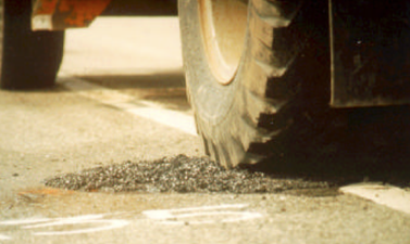 Throw-and-roll pothole repair procedure—compaction of patch