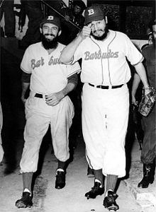 Camilo Cienfuegos and Fidel Castro dressed in their baseball uniforms
