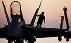 File:Defense.gov News Photo 110208-N-2055M-344 - A plane captain performs a pre-flight inspection on an F A-18C Hornet assigned to Strike Fighter Squadron 25 aboard the aircraft carrier USS Carl.jpg