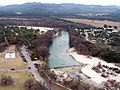 The Frio River winds along the east side of Garner State Park (on the left, showing a dam that forms a swimming area).