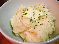 Close-up view of mashed potatoes with butter and chives