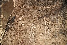 Petroglyphs of people and things