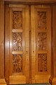 Door to the rare book room carved to a design by Eric Gill in 1935. Each panel features a famous scientist.