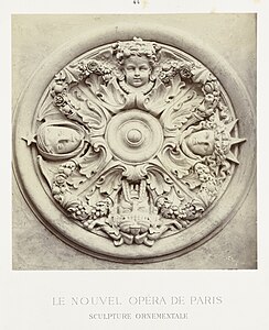 Neoclassical mascarons in a round ceiling ornament that depicts the four cardinal points, designed by Charles Garnier, c.1860–1875