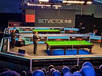 Snooker tables set up in a hall