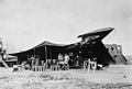A camp kitchen set up by the U.S. Army under a derelict Bloch MB.200 during the North African campaign