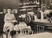 Woman with chickens in a kitchen