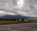 View of the mountain from Pulau Sebang, Malacca. Both North Tampin Peak and Bukit Tampin (left) are covered in clouds.