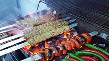 Kabobs cooking on a grill