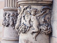 Putti on sculptural columns on the Hotel Russell facade.