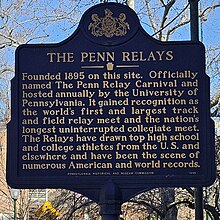 A color photograph of a historical marker describing the Penn Relays