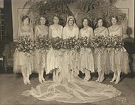 Bridesmaids gowns of 1929 have knee-length underskirts and longer, sheer over skirts, foreshadowing the trend toward longer skirts. Minnesota, 1929.