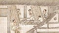 Men preparing twig frames where silkworms will spin cocoons