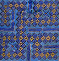 Tile from a 14th-century mausoleum in Uzbekistan, inscribed with Muhammad's name (محمد) in square Kufic; one of a set used to frame a doorway