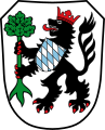 Stadt Gundelfingen a.d.Donau In Silber ein rot gekrönter und rot gezungter schwarzer Löwe, der auf der Brust den bayerischen Rautenschild und in den Pranken einen bewurzelten grünen Baum trägt.