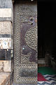 The doors of the mosque, made of wood overlaid with bronze fittings.