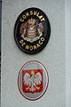 The coat of arms of Poland in Vaduz. Poland was using golden paint (like Monaco) over its metal plates till 1939, later during the communist era paint was changed to yellow.