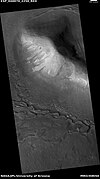 Wide view of upper plains unit eroding into hollows, as seen by HiRISE under HiWish program Parts of this image are enlarged in following images.