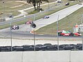 A group of Group 9 BOSS cars going around turn eight at the Kohler International Challenge