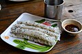 Rolled khao phan with black sesame seeds