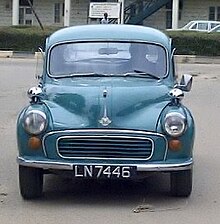 A square-shaped, teal car.