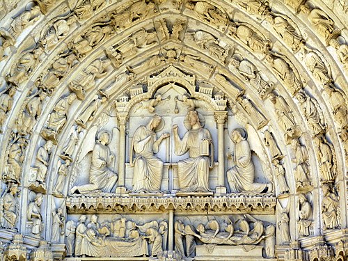 The tympanum over the center portal of the north transept. On the lintel are the Dormition (Death) and Assumption of the Virgin. Above is the Coronation of the Virgin: Mary, in her living body, will rule the heavens alongside her Son Christ.
