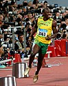 Jamaican athlete Usain Bolt slowing down after winning the 2008 Olympic Games 100 m final in a record-breaking time
