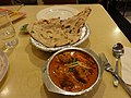 Naan with fish curry.