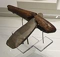 A Neolithic stone axe with a wooden handle.