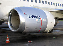 A close-up view of a CFM56-3 series engine mounted on a Boeing 737-500 showing flattening of the nacelle at the bottom of the inlet lip
