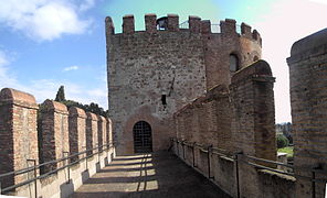 A restored section between towers on the wall.