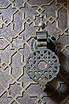 The decorative bronze plating of the doors at the madrasa's entrance (replicas of the originals)