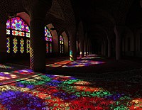 Extensive stained glasses of Nasir-ol-Molk Mosque in Shiraz, Iran and the light passing through them